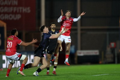 291125 - Scarlets v Glasgow Warriors - United Rugby Championship - Tomi Lewis of Scarlets challenges Kerr Johnston of Glasgow for a high ball