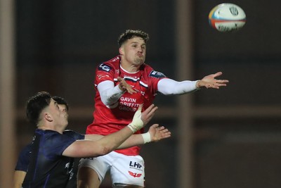 291125 - Scarlets v Glasgow Warriors - United Rugby Championship - Tomi Lewis of Scarlets challenges Kerr Johnston of Glasgow for a high ball