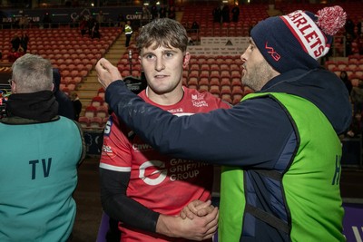 291125 - Scarlets v Glasgow Warriors - United Rugby Championship - Iori Badham of Scarlets is congratulated by Scott Sneddon 