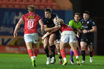 291125 - Scarlets v Glasgow Warriors - United Rugby Championship - Stafford McDowall of Glasgow is challenged by Eddie James of Scarlets