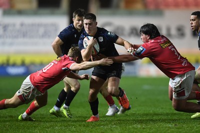291125 - Scarlets v Glasgow Warriors - United Rugby Championship - Dan Lancaster of Glasgow is challenged by Sam Costelow of Scarlets