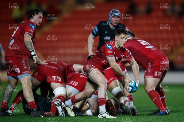 300324 - Scarlets v Glasgow Warriors - United Rugby Championship - Kieran Hardy of Scarlets passes the ball