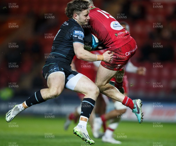 300324 - Scarlets v Glasgow Warriors - United Rugby Championship - Kyle Rowe of Glasgow and Ioan Nicholas of Scarlets compete for the ball