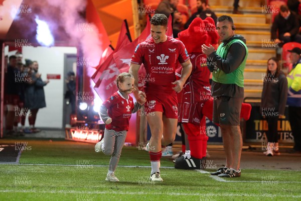300324 - Scarlets v Glasgow Warriors - United Rugby Championship - Kieran Hardy of Scarlets runs out for his 100th appearance 