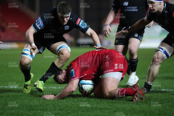 300324 - Scarlets v Glasgow Warriors - United Rugby Championship - Ryan Elias of Scarlets under pressure behind his own try line