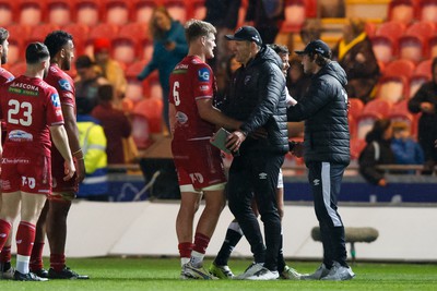 260424 - Scarlets v Hollywoodbets Sharks - United Rugby Championship - Taine Plumtree of Scarlets and Sharks head coach John Plumtree at the end of the match