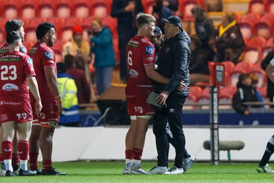 260424 - Scarlets v Hollywoodbets Sharks - United Rugby Championship - Taine Plumtree of Scarlets and Sharks head coach John Plumtree at the end of the match