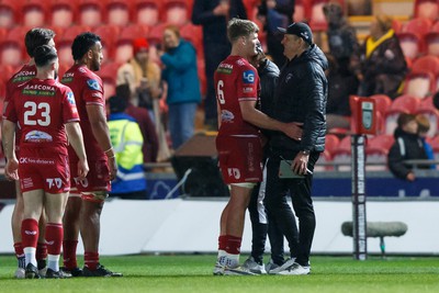 260424 - Scarlets v Hollywoodbets Sharks - United Rugby Championship - Taine Plumtree of Scarlets and Sharks head coach John Plumtree at the end of the match