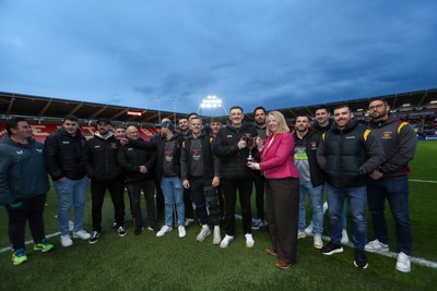 260424 - Scarlets v Hollywoodbets Sharks - United Rugby Championship - WRU CEO Abi Tierney presents the Division one Cup to players and coaches from Llanelli Wanderers RFC