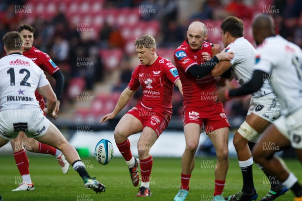 260424 - Scarlets v Hollywoodbets Sharks - United Rugby Championship - Sam Costelow of Scarlets kicks the ball