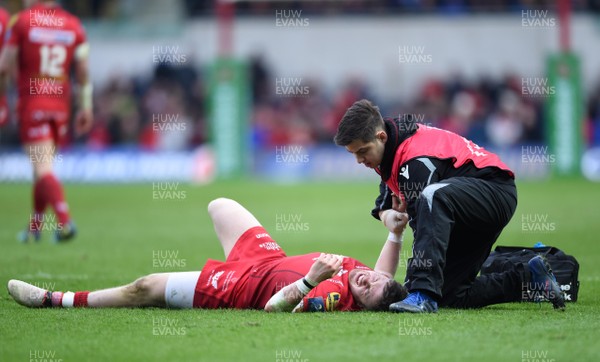 300318 - Scarlets v La Rochelle - European Rugby Champions Cup - Steff Evans of Scarlets is treated for injury