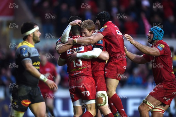300318 - Scarlets v La Rochelle - European Rugby Champions Cup - Scott Williams of Scarlets celebrates his try with team mates