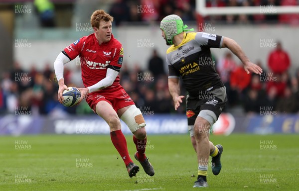 300318 - Scarlets v La Rochelle - European Champions Cup Quarter Final - Rhys Patchell of Scarlets is challenged by Kevin Gourdon of La Rochelle
