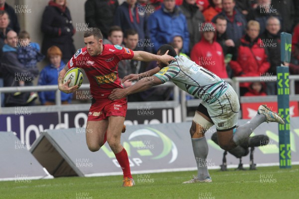 030213 Scarlets v Leicester - LV= Cup - Scarlets' Kyle Evans is stopped by Leicester's Vereniki Goneva as he makes a break 