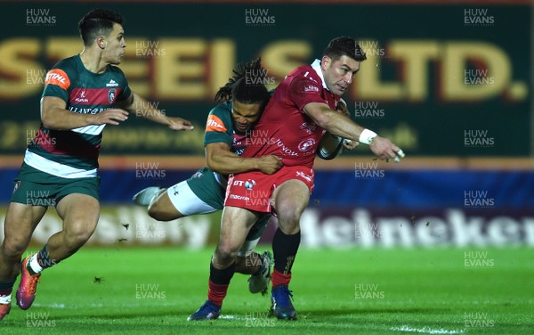 120119 - Scarlets v Leicester Tigers - European Rugby Heineken Champions Cup - Kieron Fonotia of Scarlets is tackled by Kyle Eastmond of Leicester Tigers