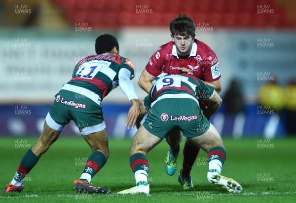 120119 - Scarlets v Leicester Tigers - European Rugby Heineken Champions Cup - Dan Jones of Scarlets is tackled by Ben White of Leicester Tigers