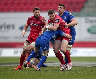 070315 - Scarlets v Leinster - Guinness PRO12 - Scott Williams of Scarlets is tackled by Eoin Reddan and Jack Conan of Leinster