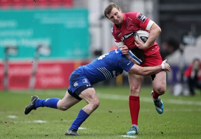 070315 - Scarlets v Leinster - Guinness PRO12 - Hadleigh Parkes of Scarlets is tackled by Fergus McFadden of Leinster