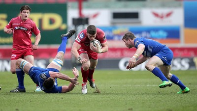 070315 - Scarlets v Leinster - Guinness PRO12 - Scott Williams of Scarlets slips past Dominic Ryan of Leinster