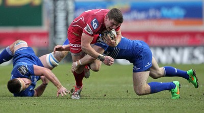 070315 - Scarlets v Leinster - Guinness PRO12 - Scott Williams of Scarlets is tackled by Gordon D'Arcy of Leinster