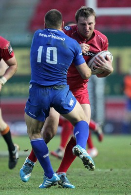 070315 - Scarlets v Leinster - Guinness PRO12 - Hadleigh Parkes of Scarlets is tackled by Jimmy Gopperth of Leinster