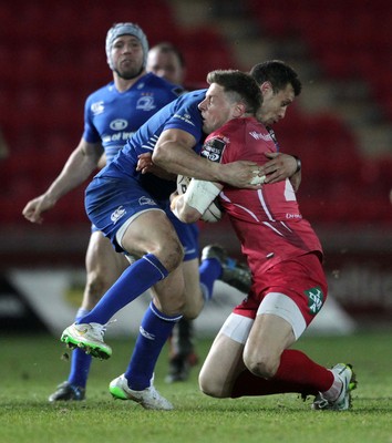 070315 - Scarlets v Leinster - Guinness PRO12 - Rhys Priestland of Scarlets is tackled by Zane Kirchner of Leinster