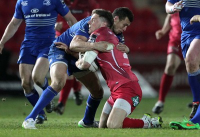 070315 - Scarlets v Leinster - Guinness PRO12 - Rhys Priestland of Scarlets is tackled by Zane Kirchner of Leinster