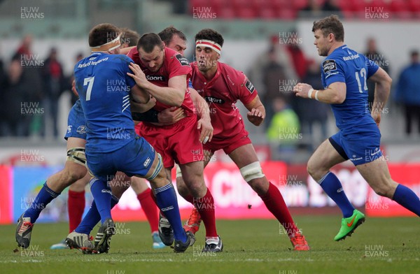 070315 - Scarlets v Leinster - Guinness PRO12 - Ken Owens of Scarlets is tackled by Dominic Ryan of Leinster