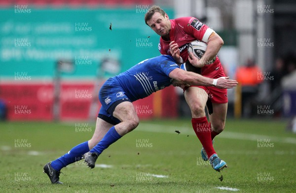 070315 - Scarlets v Leinster - Guinness PRO12 - Hadleigh Parkes of Scarlets is tackled by Fergus McFadden of Leinster