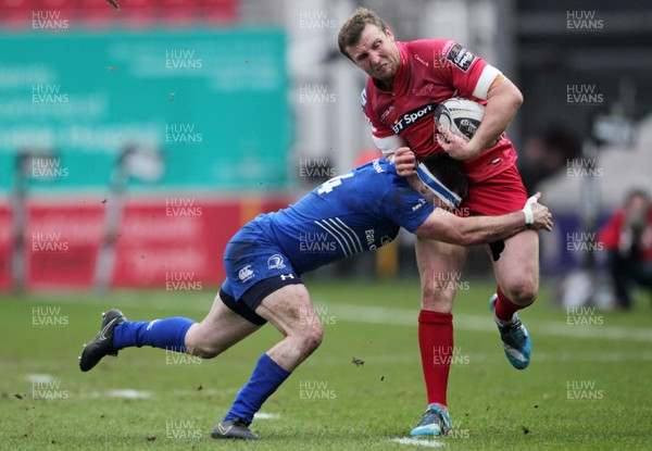 070315 - Scarlets v Leinster - Guinness PRO12 - Hadleigh Parkes of Scarlets is tackled by Fergus McFadden of Leinster