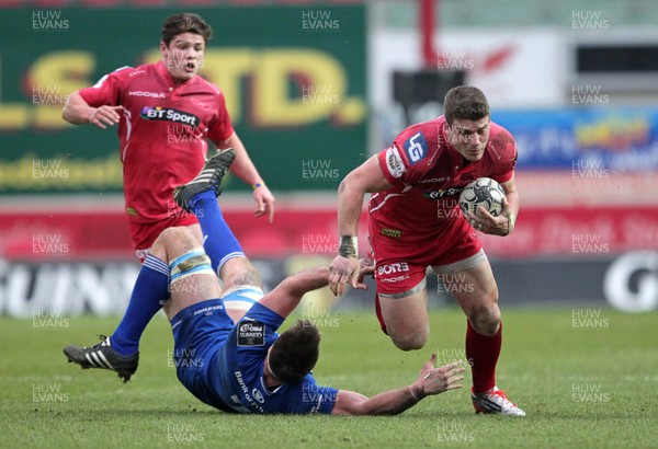 070315 - Scarlets v Leinster - Guinness PRO12 - Scott Williams of Scarlets slips past Dominic Ryan of Leinster