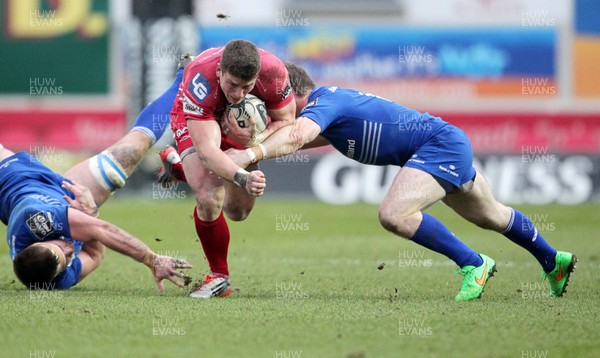 070315 - Scarlets v Leinster - Guinness PRO12 - Scott Williams of Scarlets is tackled by Gordon D'Arcy of Leinster