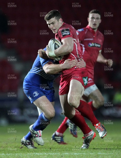 070315 - Scarlets v Leinster - Guinness PRO12 - Scott Williams of Scarlets is tackled by Zane Kirchner of Leinster