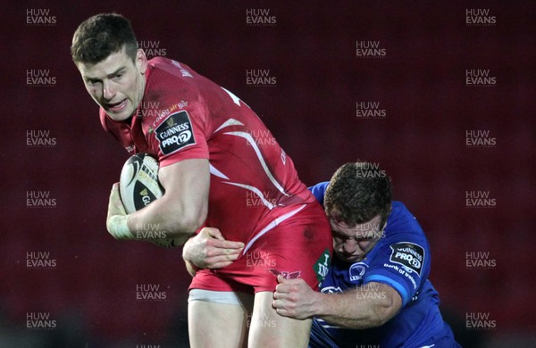 070315 - Scarlets v Leinster - Guinness PRO12 - Scott Williams of Scarlets is tackled by Zane Kirchner of Leinster