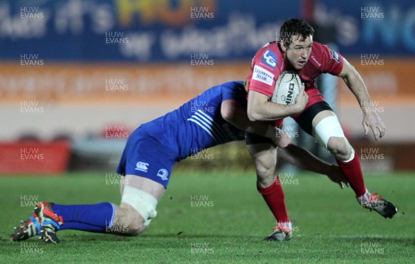 070315 - Scarlets v Leinster - Guinness PRO12 - Adam Warren of Scarlets is tackled by Tom Denton of Leinster