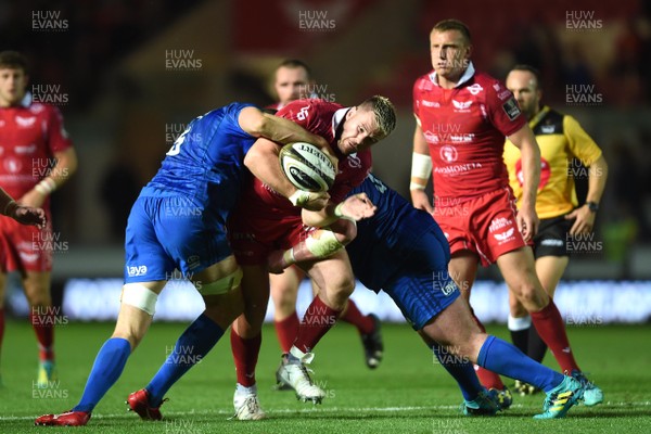 080918 - Scarlets v Leinster - Guinness PRO14 - Rob Evans of Scarlets is tackled by Ian Nagle and Tadhg Furlong of Leinster