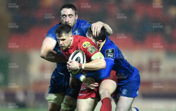 090318 - Scarlets v Leinster - Guinness PRO14 - Tom Williams of Scarlets is tackled by Jack Conan and Barry Daly of Leinster