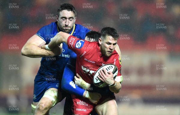 090318 - Scarlets v Leinster - Guinness PRO14 - Tom Williams of Scarlets is tackled by Jack Conan and Barry Daly of Leinster