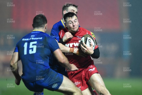 090318 - Scarlets v Leinster - Guinness PRO14 - Ryan Conbeer of Scarlets is tackled by Dave Kearney and Nick McCarthy of Leinster