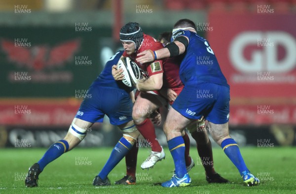 090318 - Scarlets v Leinster - Guinness PRO14 - Ryan Elias of Scarlets is tackled by Josh Murphy and Michael Bent of Leinster