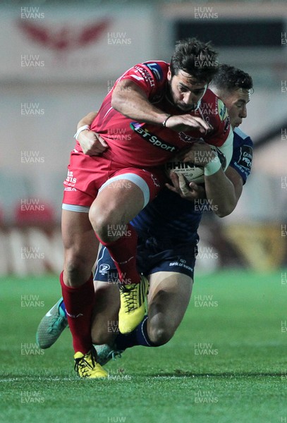 161015 - Scarlets v Leinster - Guinness PRO12 - Gareth Owen of Scarlets is tackled by Noel Reid of Leinster