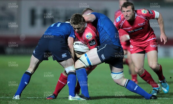 161015 - Scarlets v Leinster - Guinness PRO12 - Aled Thomas of Scarlets is tackled by Fergus McFadden and Dan Leavy of Leinster