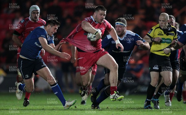 161015 - Scarlets v Leinster - Guinness PRO12 - Rob Evans of Scarlets smashes past Ross Byrne of Leinster