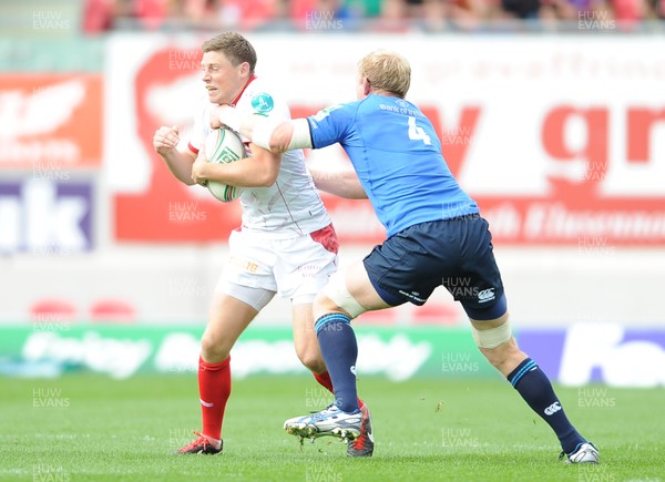 201012 - Scarlets v Leinster - Heineken Cup -Rhys Priestland of Scarlets is tackled by Sean Cronin and Leo Cullen of Leinster