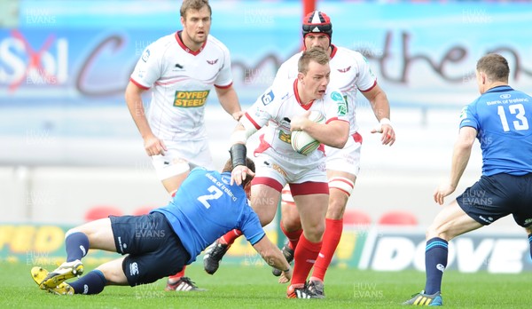 201012 - Scarlets v Leinster - Heineken Cup -Matthew Rees of Scarlets is tackled by Sean Cronin of Leinster