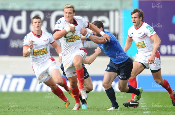 201012 - Scarlets v Leinster - Heineken Cup -Gareth Maule of Scarlets gets past Fergus McFadden of Leinster