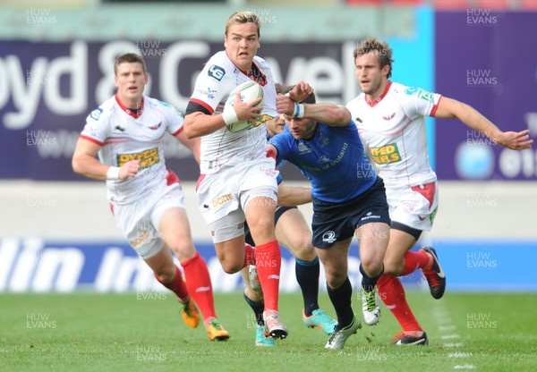 201012 - Scarlets v Leinster - Heineken Cup -Gareth Maule of Scarlets gets past Fergus McFadden of Leinster