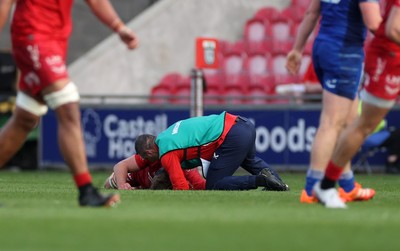 260425 - Scarlets v Leinster - United Rugby Championship - Taine Plumtree of Scarlets leaves the field injured