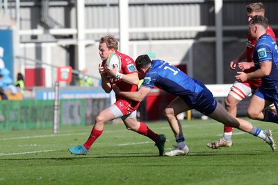 260425 - Scarlets v Leinster - United Rugby Championship - Blair Murray of Scarlets is tackled by Jimmy O’Brien of Leinster 