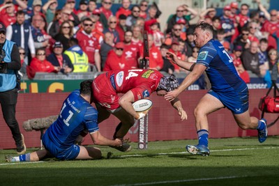 260425 - Scarlets v Leinster - United Rugby Championship - Jimmy O’Brien of Leinster brings down Tom Rogers of Scarlets